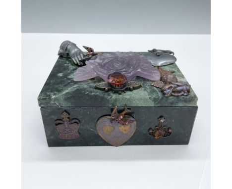 This handcrafted green marble box exudes vintage elegance, adorned with intricate metallic embellishments and a stunning carv