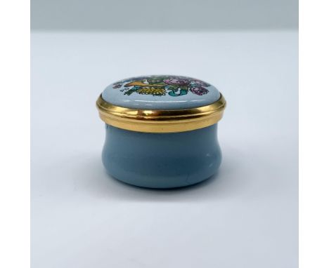 This miniature enamel box is dedicated to the year 1998, with a beautiful flower arrangement on top, on a light blue backgrou