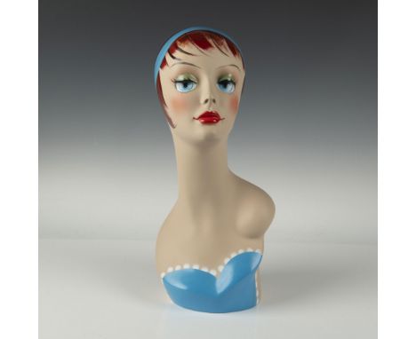 An Art Deco-inspired hand-painted mannequin bust radiating vintage sophistication. Featuring sleek, crimson hair adorned with