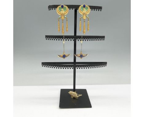This lot features a striking collection of vintage-inspired jewelry, including a pair of Elizabeth Taylor for Avon Egyptian R