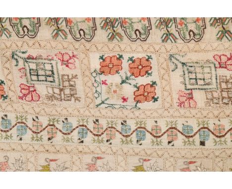A composite Qibleh cloth, Ottoman, assembled circa 1870 from earlier fabrics, with central floral mihrab worked with a cypres