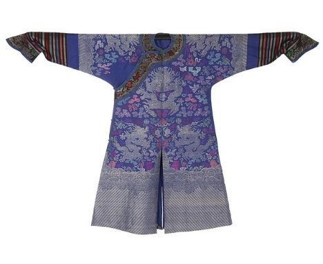 A good brocaded silk summer jifu/dragon robe, Chinese, circa 1900, the royal-blue ground woven with nine silver dragons with 