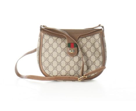 Four Gucci bags, modern, comprising three of GG print leather with classic green and red bands, and one of snakeskin print le