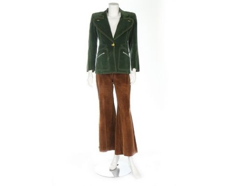 A Mr Freedom green velvet jacket and flared trousers, 1971, the jacket with yellow buttons and large curved lapels, woven lab