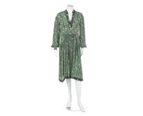 An Ossie Clark printed rayon dress, mid 1970s, un-labelled, with two curved pockets to front skirt, the green and black print