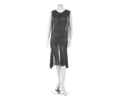 A black chiffon beaded flapper dress, French, circa 1929, size 48 label, the dipped hemline falling longer to each side, the 