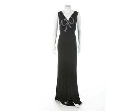 A good black bias-cut jersey evening gown, circa 1937, un-labelled, with large bow to front of silver bugle beads, low back, 