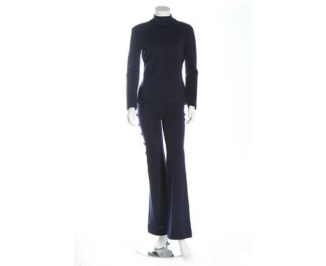 A Gianni Versace navy knitted wool jersey ensemble, 1993, labelled 'Gianni Versace Couture' and size EU 38, the matelot trous