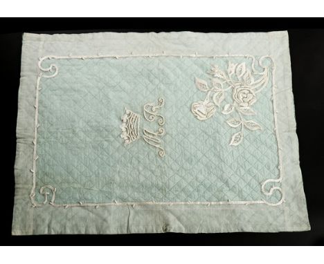 A whitework embroidered tulle and quilted blue satin cover, 1930s, embroidered MR below a coronet, 117 by 87cm; together with