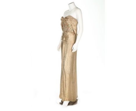 A Juliette Verneuil gold lame 'goddess' dress, circa 1949-50, with embroidered label and atelier name 'A.Rolande' to the bold