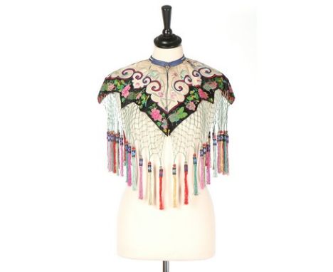 An embroidered 'cloud' collar, Chinese, circa 1910, with woven ribbon borders and elaborate silk fringing; together with a bl