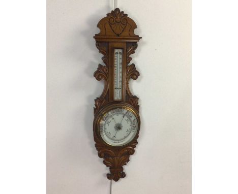 VICTORIAN OAK ANEROID WHEEL BAROMETER AND THERMOMETER,white enamel dials, scroll and foliate carved surround, 88cm high