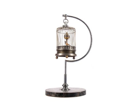 EARLY 20TH CENTURY AUSTRIAN NOVELTY AUTOMATON BIRDCAGE CLOCK,chrome plated with a marble circular base, 28.5cm highThis is ea
