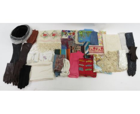 A collection of vintage hats and silk Hermes style scarves