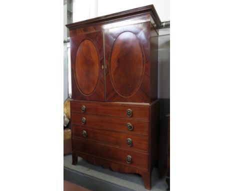 A 19th century mahogany linen press, with two fitted sliding drawers and four long drawers, on bracket feet, 209cm high, 122c