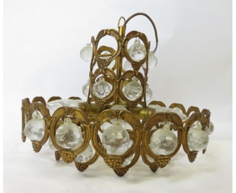 A 20th century two section gilt metal hanging chandelier, with spherical glass drops