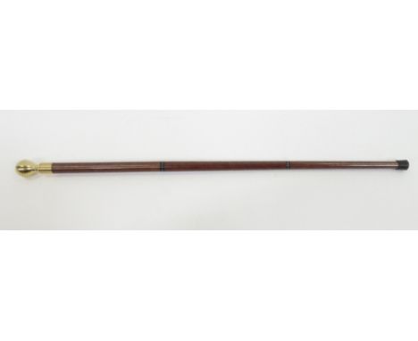 A vintage walking stick, with hidden shot glass section