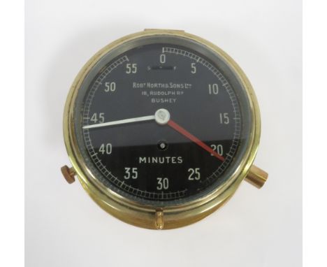 A brass mounted minute timer by Robert North &amp; Sons, Bushey