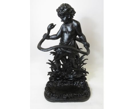 A Victorian Coalbrookdale black painted iron stick stand in the form of infant Hercules and the serpent, with a detachable dr