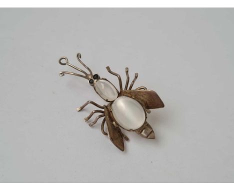 A vintage silver moonstone bug brooch 
