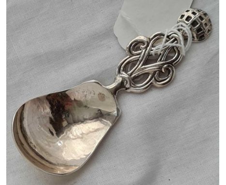 An unusual caddy spoon with hammered bowl and world type finial - London 1932 by A &amp; C?