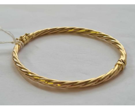 A rope twist hinged bangle 9ct - 4 gms 