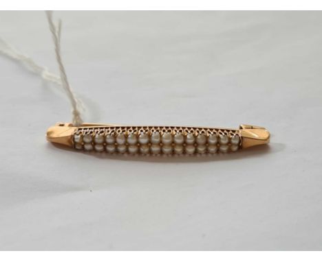 A good two row pearl brooch set in gold - 6 gms 