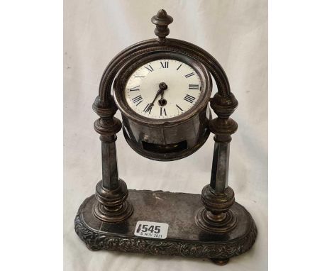 A Electro plated clock on a gimble with stand