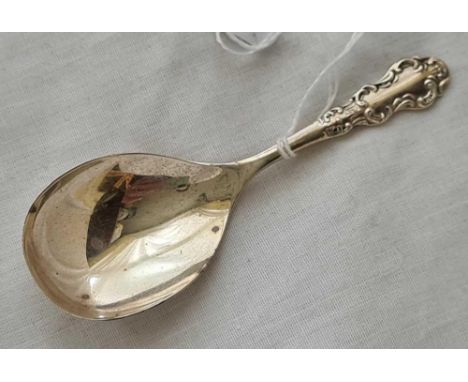 A caddy spoon with scroll decorated handle – Birmingham 1962