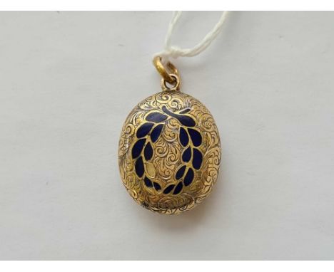 A oval gold and enamel hair locket / pendant 