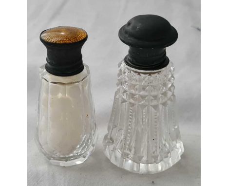 Two silver top scent bottles, one enamel decorated, glass bodies