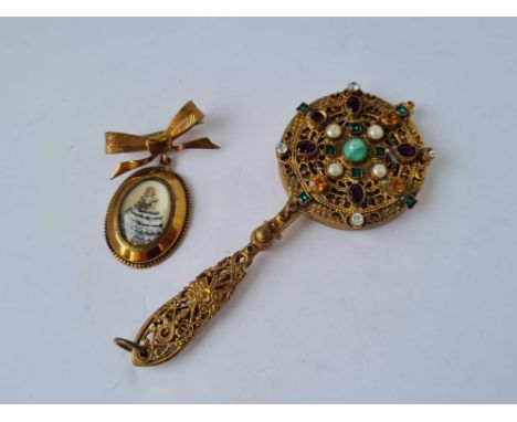 A Thomas L Mott gilt metal brooch and a gilt  stone set vintage handbag mirror