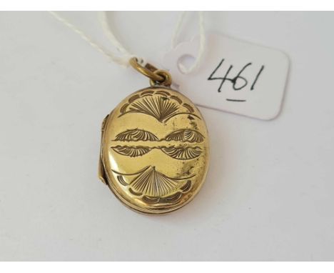 A Victorian scroll engraved 9ct back &amp; front locket with enamel front