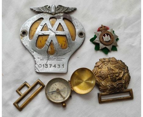 A AA badge a military buckle compass etc.