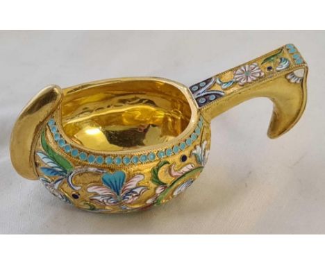 A silver gilt and enamel decorated bowl with handle – 4” over handle - stamped 84 with head – 72 g.