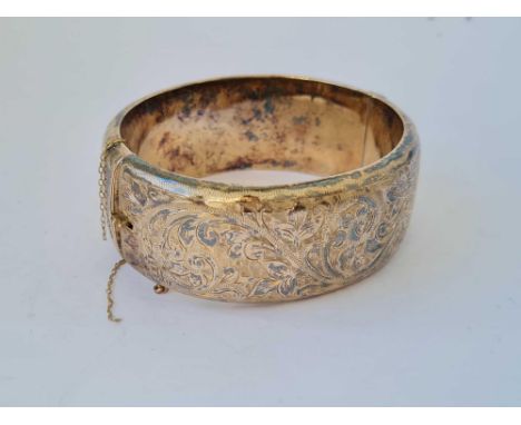 A wide vintage silver gilt scroll engraved hinged bangle 44.2g