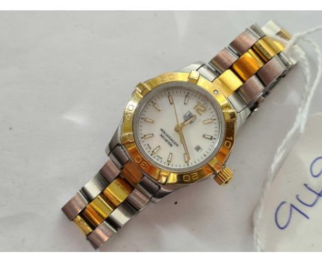 A LADIES BI METAL TAG HEUER AQUARACER 300 METERS WITH SECONDS SWEEP AND DATE APERTURE WITH SPARE LINKS AND TAG POUCH 
