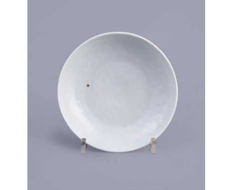 A fine Chinese moulded shufu dish, Yuan Dynasty (1279-1368), the centre of the shallow dish moulded with four stylised lotus 