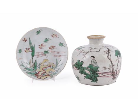 A small Chinese Wucai dish, Ming Dynasty, Tianqi or Chongzhen Period, the interior with flowering plants and bamboo in the fo