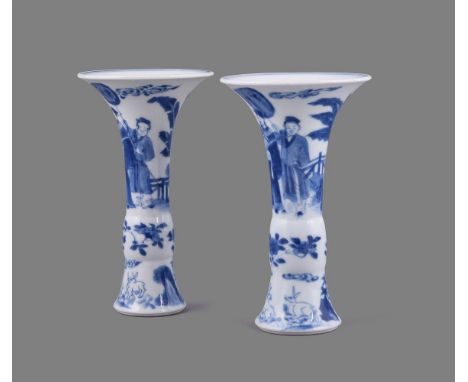 A fine pair of Chinese porcelain blue and white small beaker vases, gu, Kangxi 1662-1722, with wide flared mouths, each paint