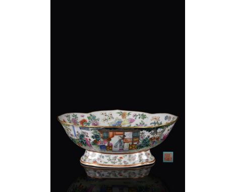 A good Chinese Famille Rose fruit Bowl, Jiaqing iron-red six character seal mark and of the period (1796-1820), of lobed oval