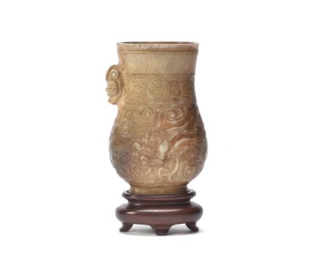 A good Chinese 'Chicken bone' jade pouring vessel, zhi, Song-Ming Dynasty, the flattened pear-shaped body supported on a tall