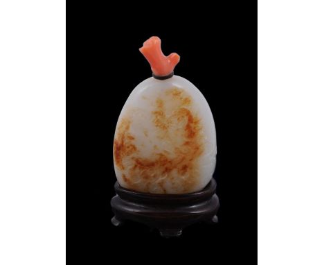 Y A Chinese russet and white jade pebble-form snuff bottle, Qing dynasty, 18th or 19th century, exceptionally well hollowed, 