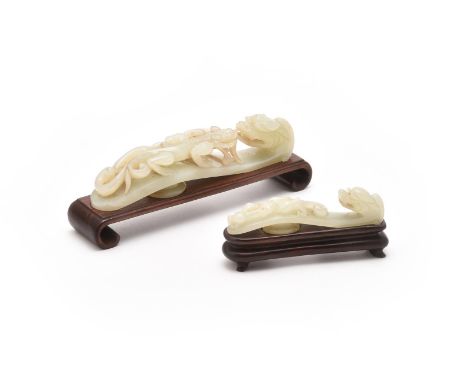 Two Chinese white jade belt hooks, 18th century, Qing Dynasty, each carved with a scrolling chilong dragon and with a dragon 