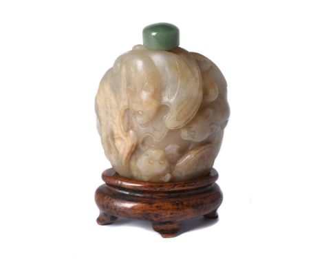 A Chinese celadon jade 'Five bats' snuff bottle, Qing Dynasty, the stone intricately carved with five bats with their wings o