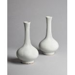 A pair of Chinese white glazed vases