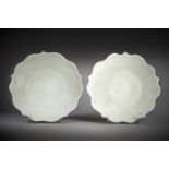 A fine pair of white-glazed five-petalled foliate dishes