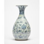 A provincial Chinese blue and white bottle vase