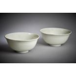 A pair of Chinese white glazed bowls