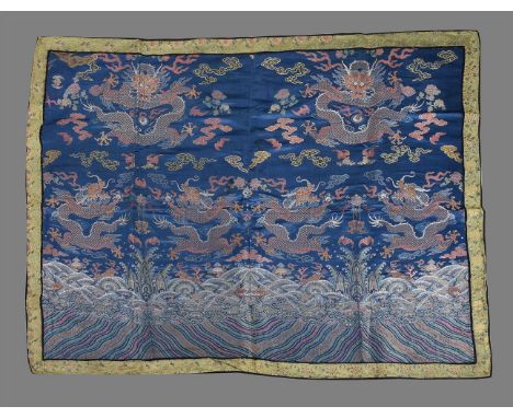 The front and back of a Chinese Dragon robe, Qing Dynasty, 19th century, woven brocade, probably made for offering to a Tibet